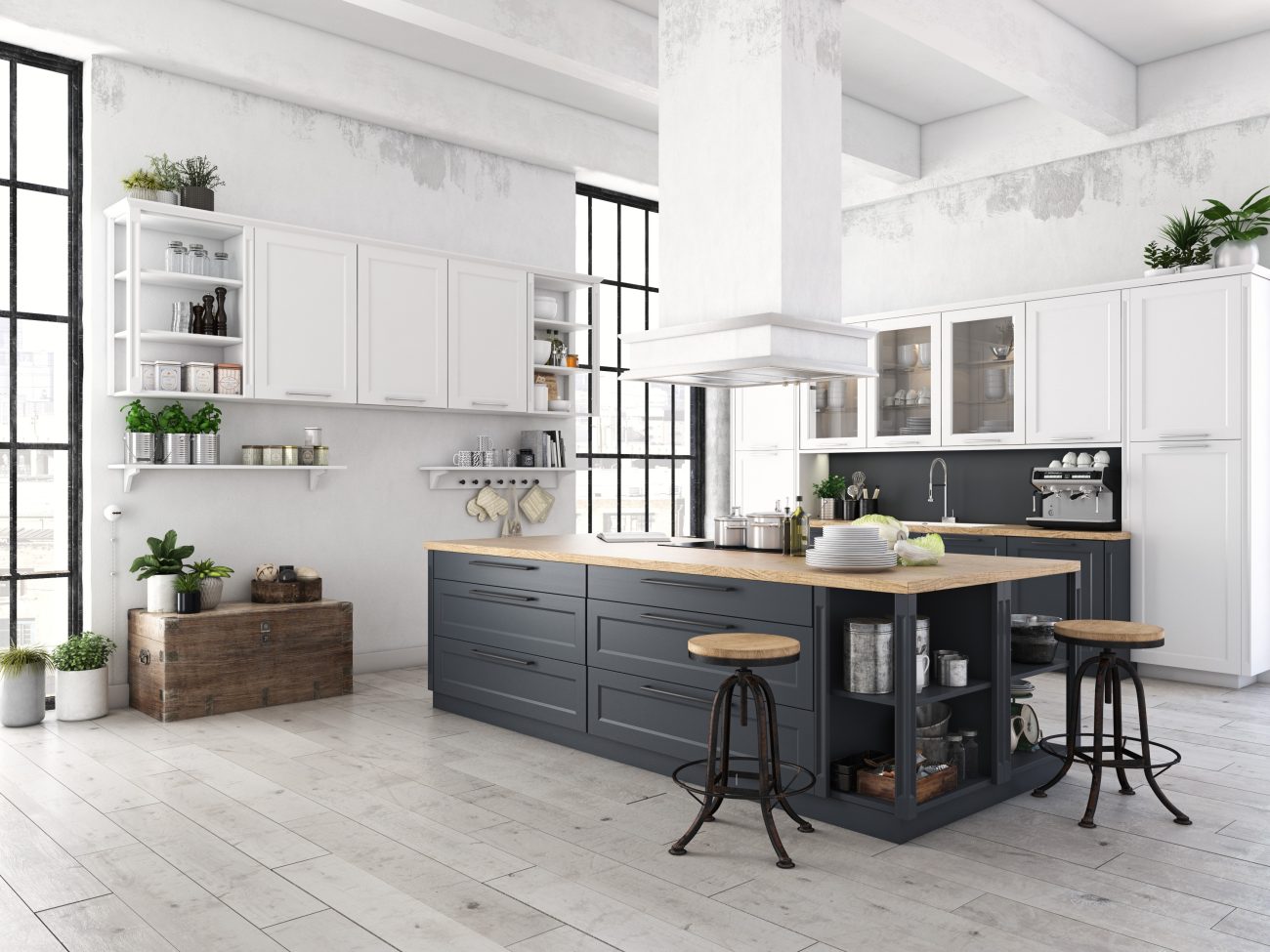 Modern kitchen in a loft décor with black island and white cabinets, counter stools and industrial style windows