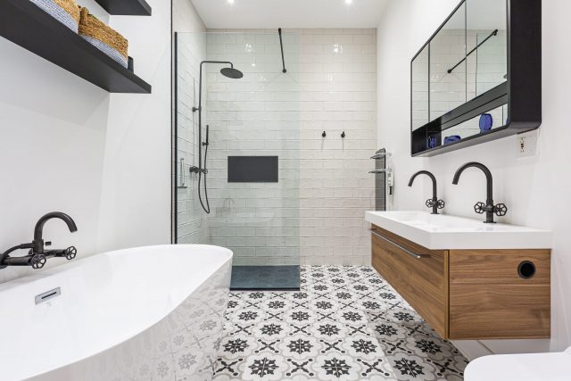 Bathroom, geometric cement tiles, oval bathtub, subway tile shower