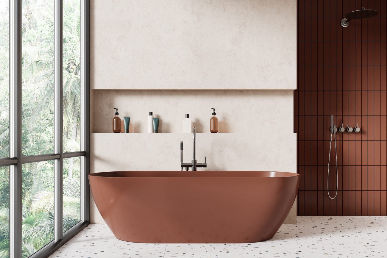 Luxury bathroom with panoramic window, freestanding oval bathtub, walk-in shower with chocolate-brown Kit-Kat effect tiles, and a niche in a travertine wall containing care products