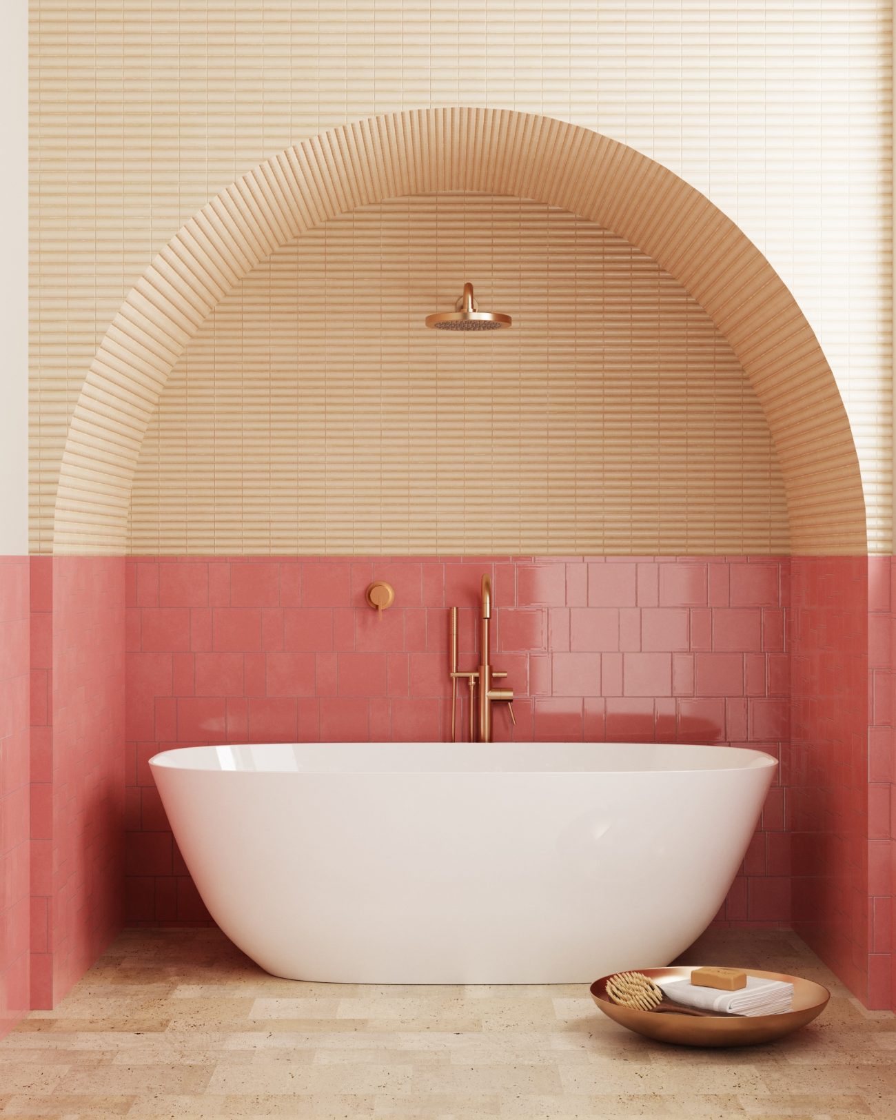 In a luxury bathroom, freestanding white bathtub in an arched alcove with a wall half-covered in strawberry frappe-pink glazed ceramic tiles, the other half in narrow biscuit-coloured tiles, travertine floor, and wooden tray on the floor with bath accessories