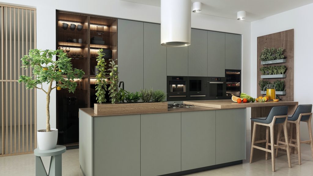 Olive-green kitchen with white hood and herb plants  