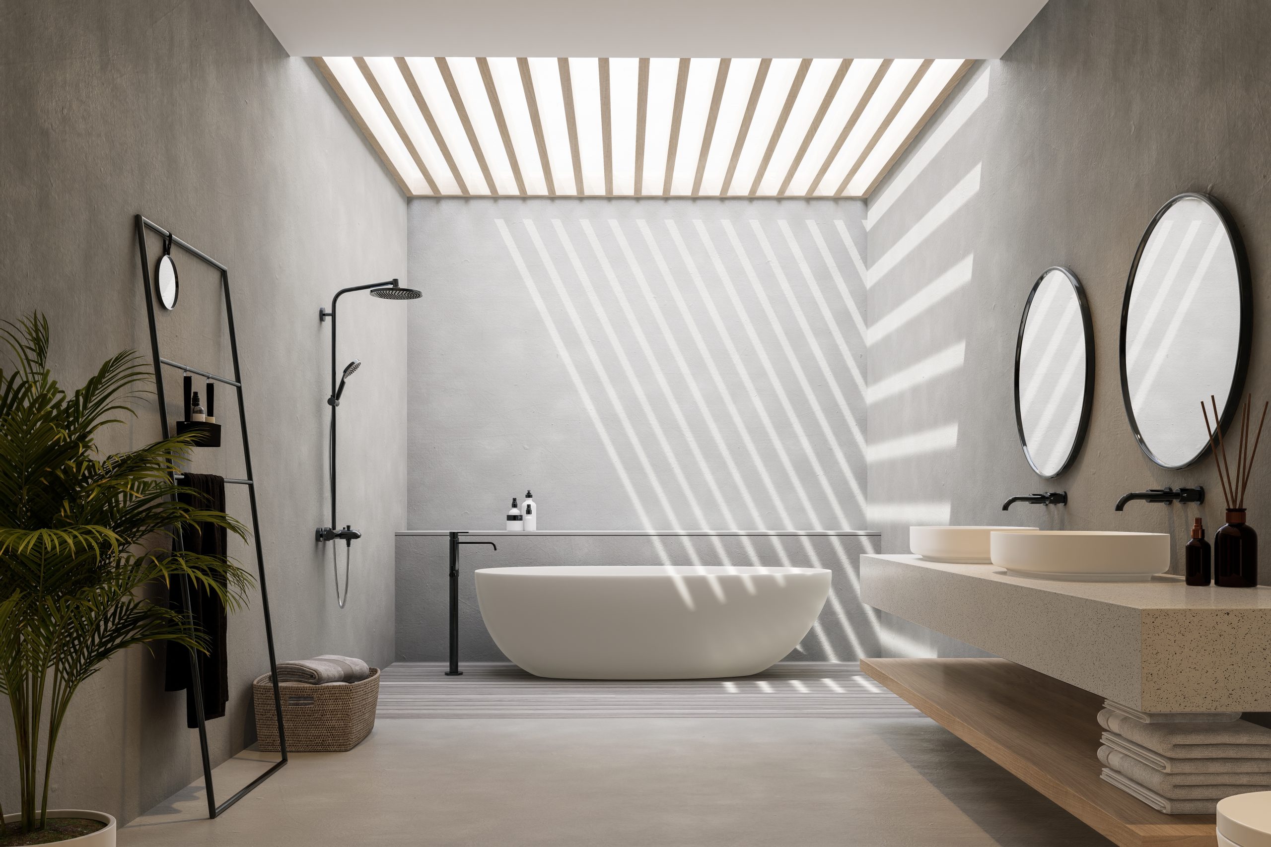 Concrete wall and floor in a bathroom with a ceiling that lets in light 