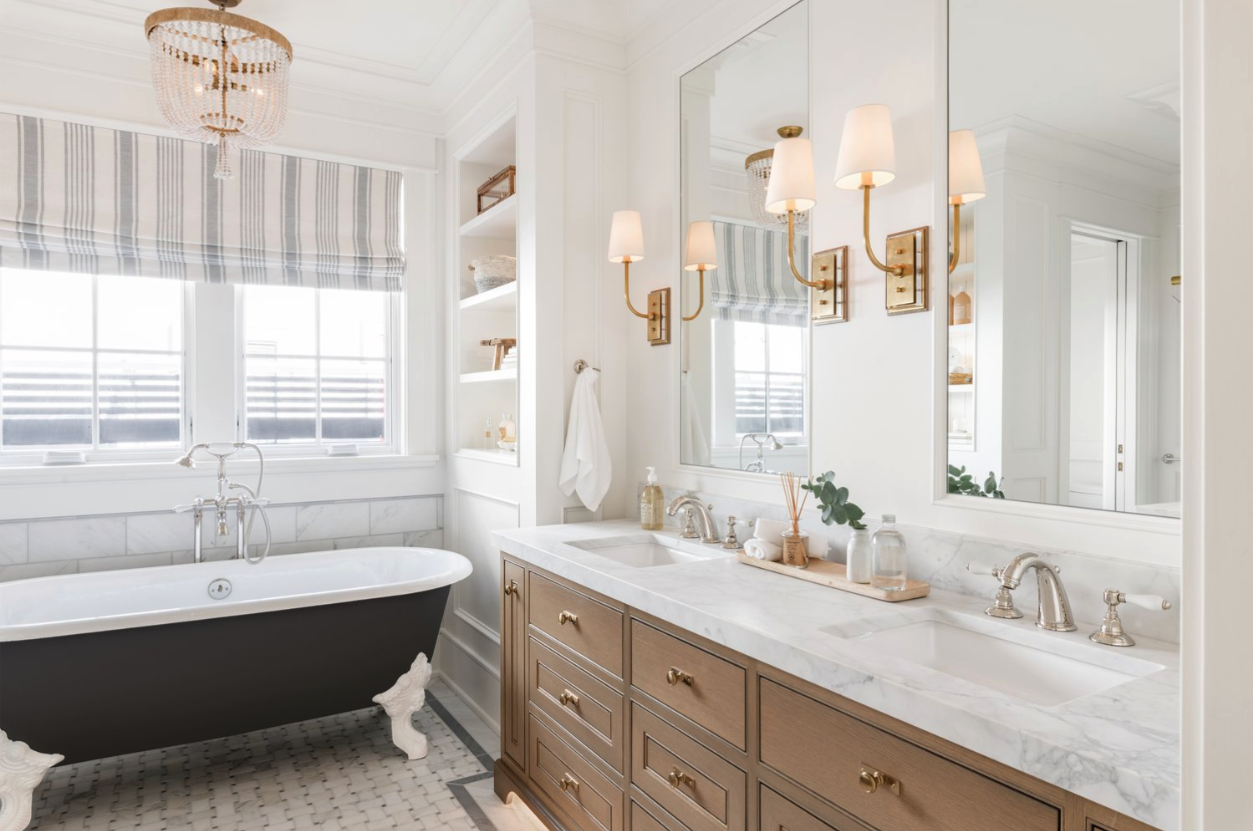 Silver faucets and wall lights with gold accents 