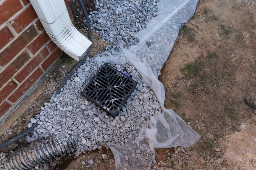 A gutter is connected to the weeping tile